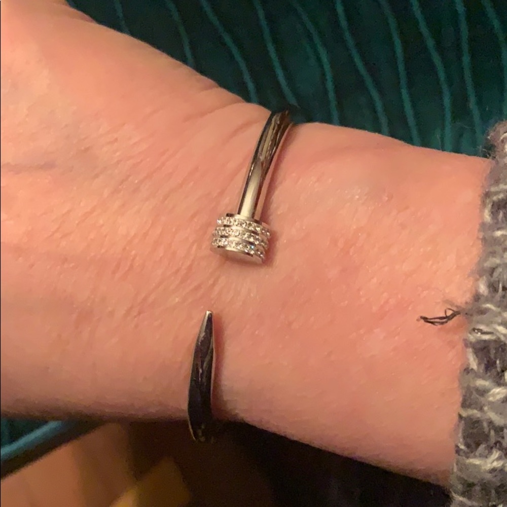 Silver color stylized nail bracelet